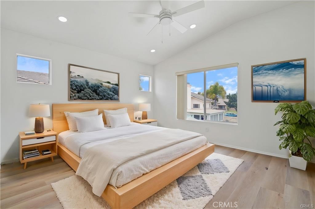 701 Caliente Way Oxnard, CA 93036 - Photo 7 of 7 a bedroom with a large bed and a painting on the wall