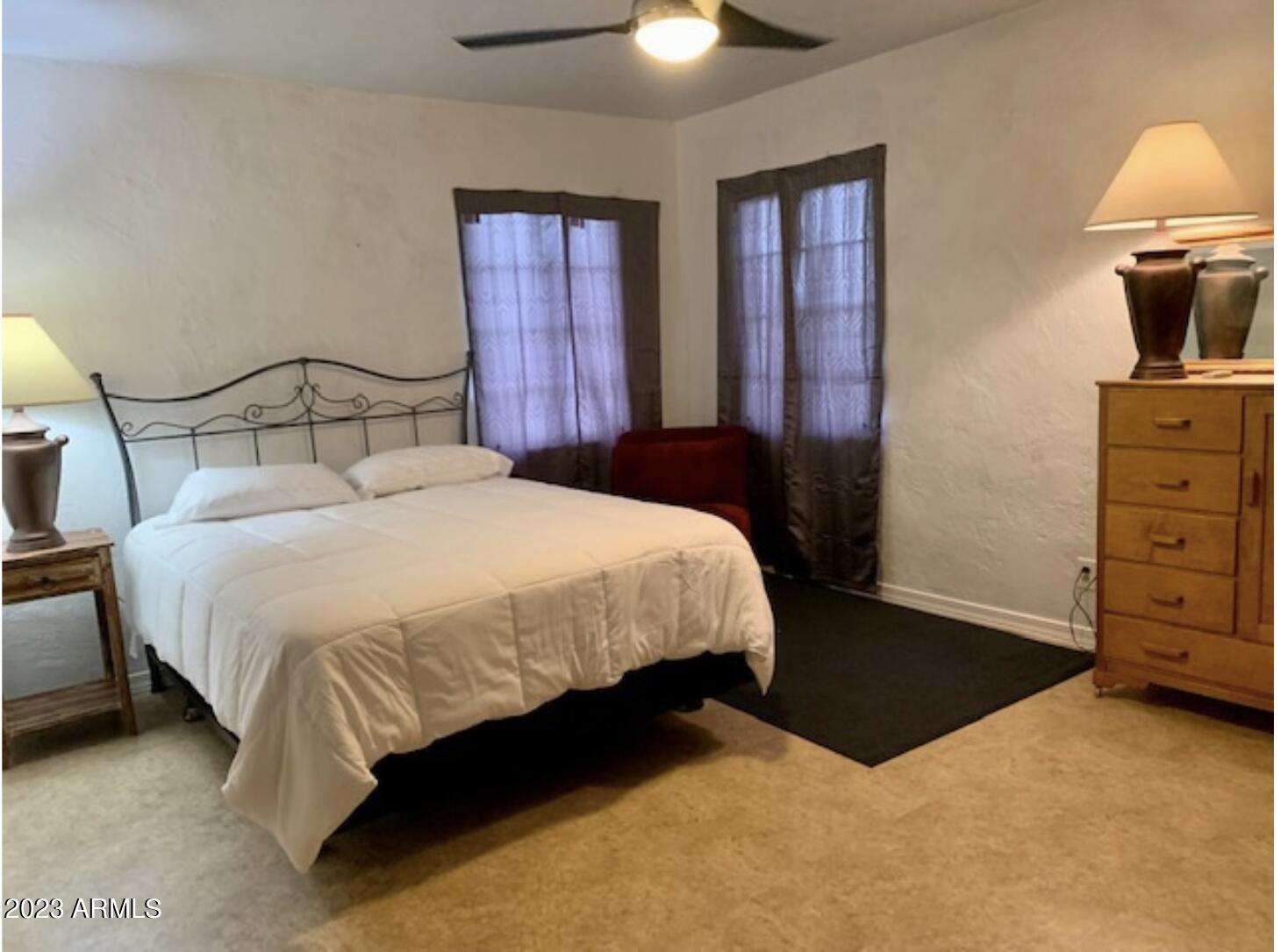 877 East Sycamore Street, Unit A Globe, AZ 85501 - Photo 2 of 8 a bedroom with a bed and a dresser
