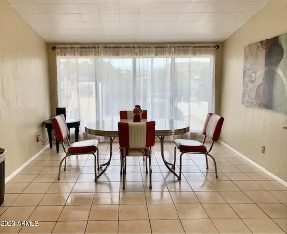 a kitchen with stainless steel appliances granite countertop a sink refrigerator and microwave