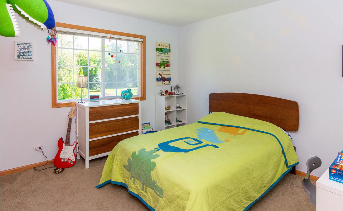 1934 Manning Road Darien, IL 60561 - Photo 12 of 18 a bedroom with a bed and a window