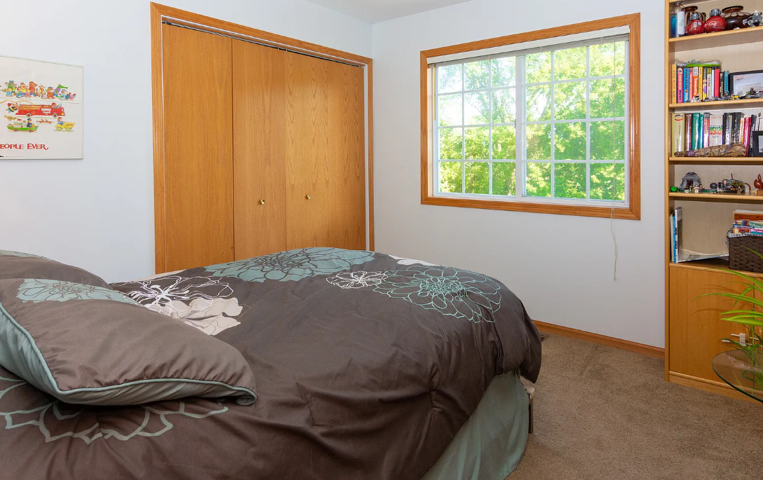 1934 Manning Road Darien, IL 60561 - Photo 13 of 18 a bedroom with a bed and a window