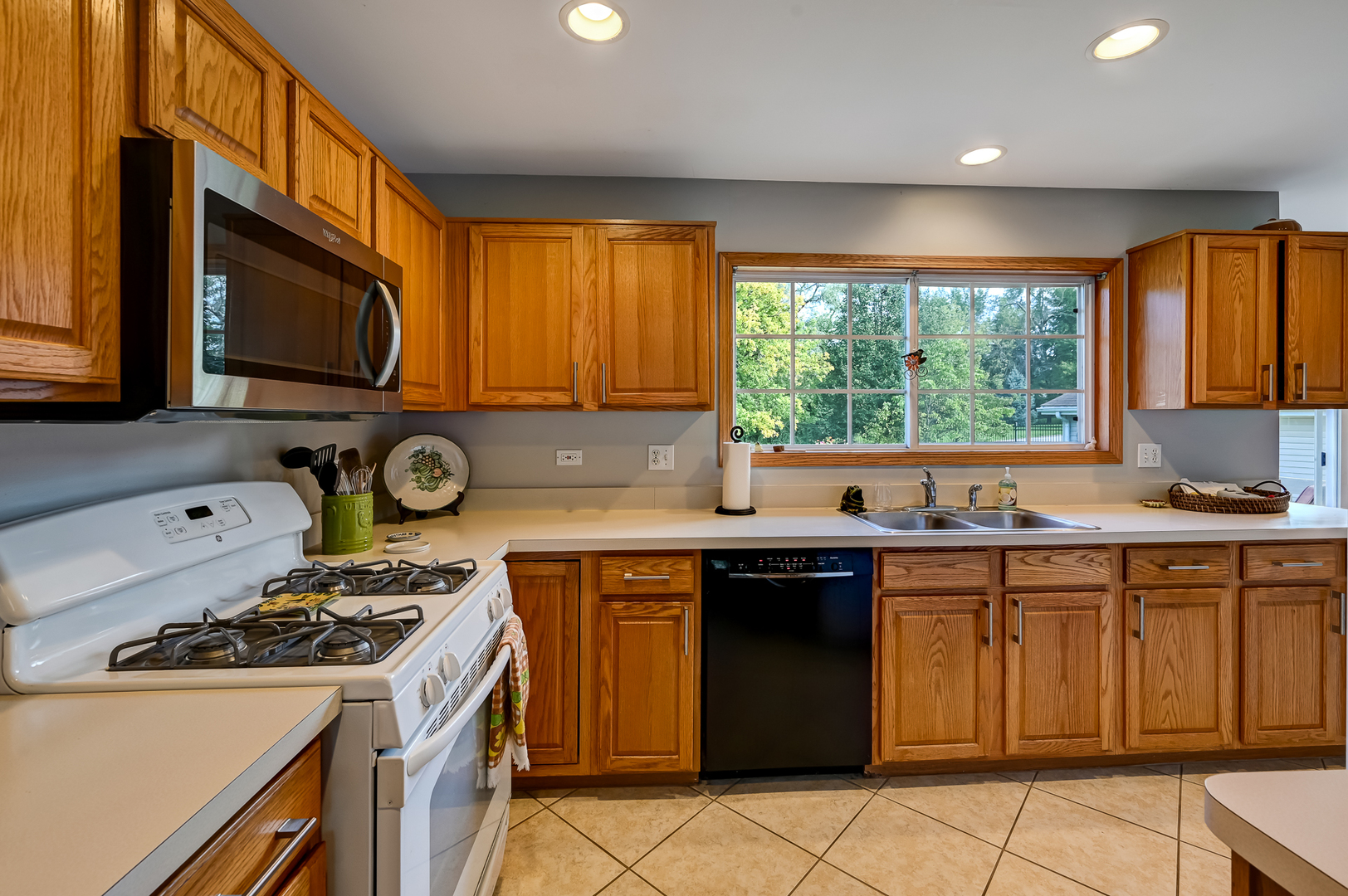 1934 Manning Road Darien, IL 60561 - Photo 5 of 18 a kitchen with a stove sink and microwave