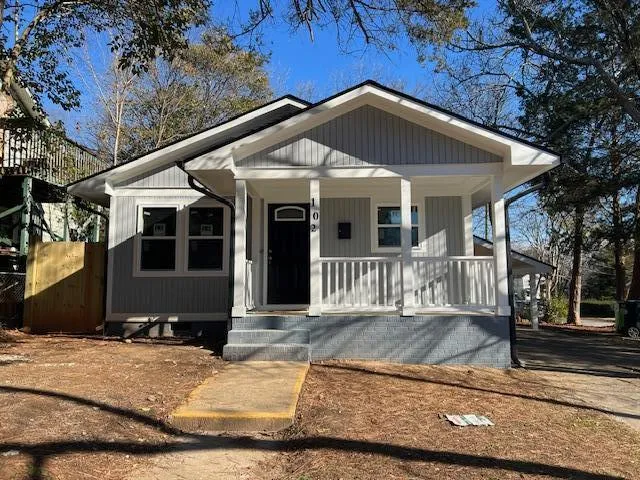 a front view of a house with yard