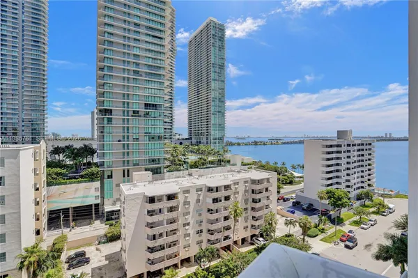 a kitchen with stainless steel appliances granite countertop a stove and a refrigerator