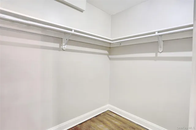 a view of a room with shelf on the wall