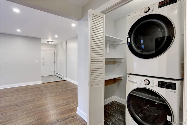 a view of a hallway with washer and dryer