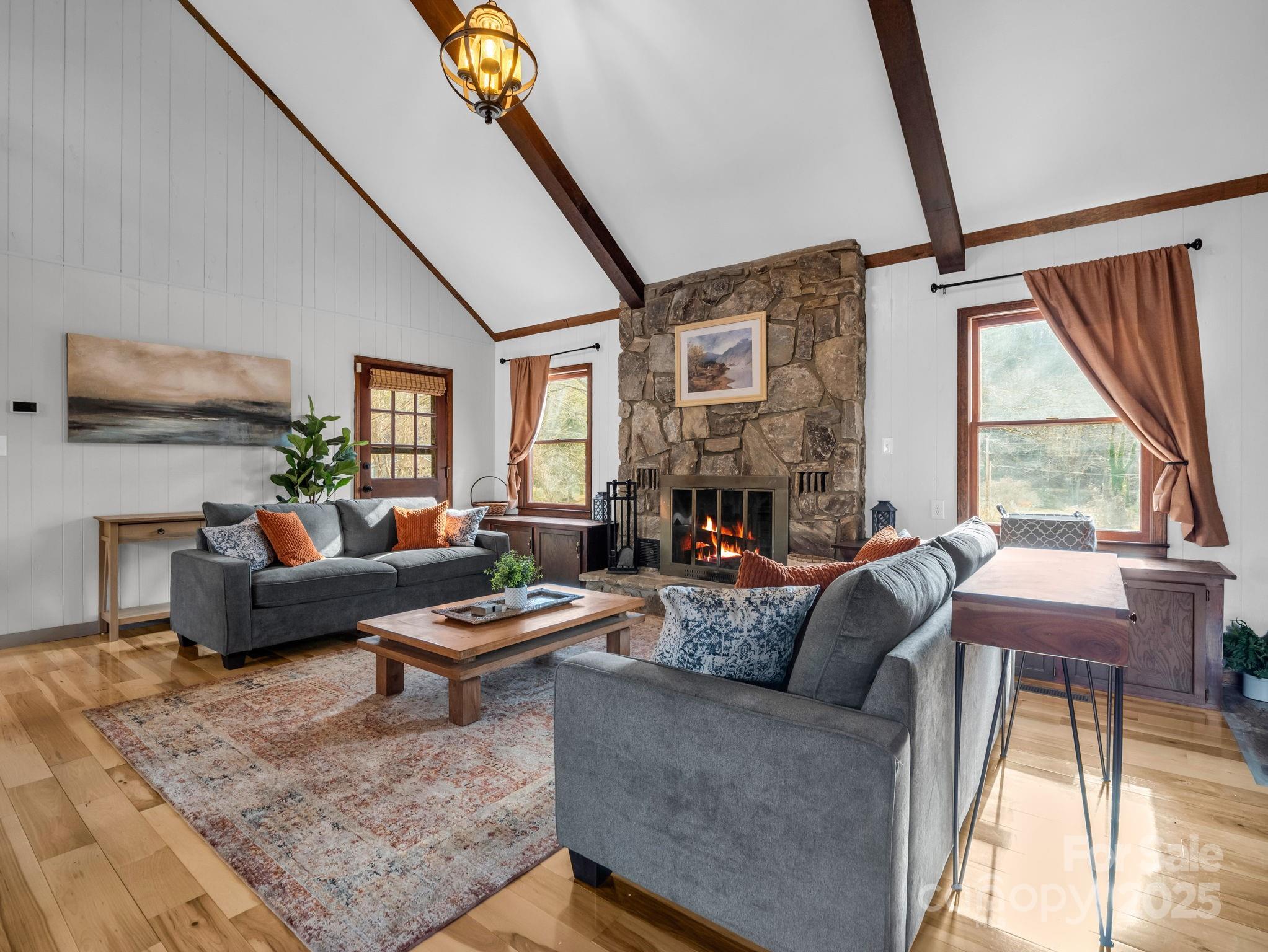 132 Hurd Road Canton, NC 28716 - Photo 20 of 46 a living room with furniture fireplace and a large window