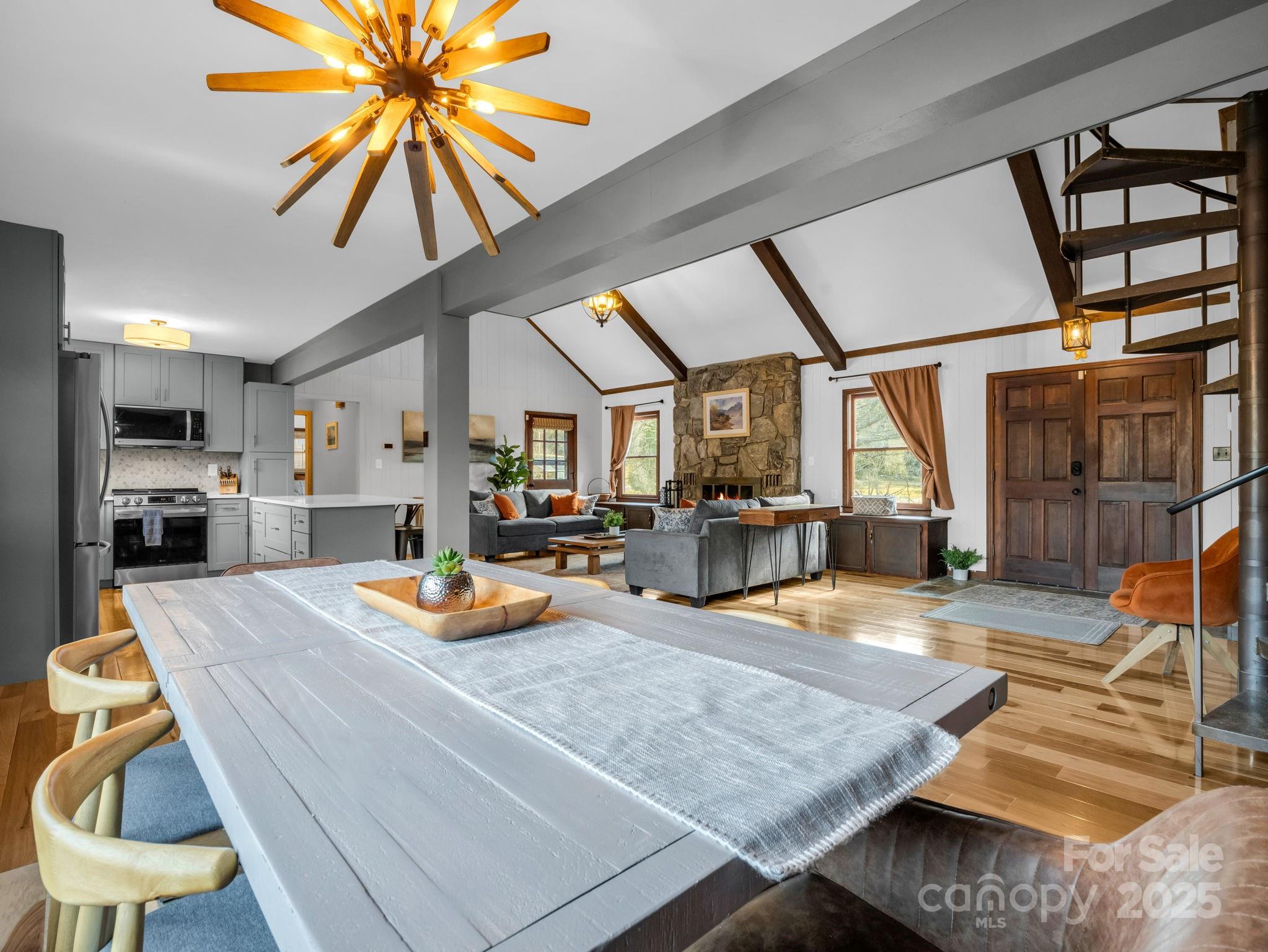 132 Hurd Road Canton, NC 28716 - Photo 29 of 46 a view of a kitchen with kitchen island dining table and chairs