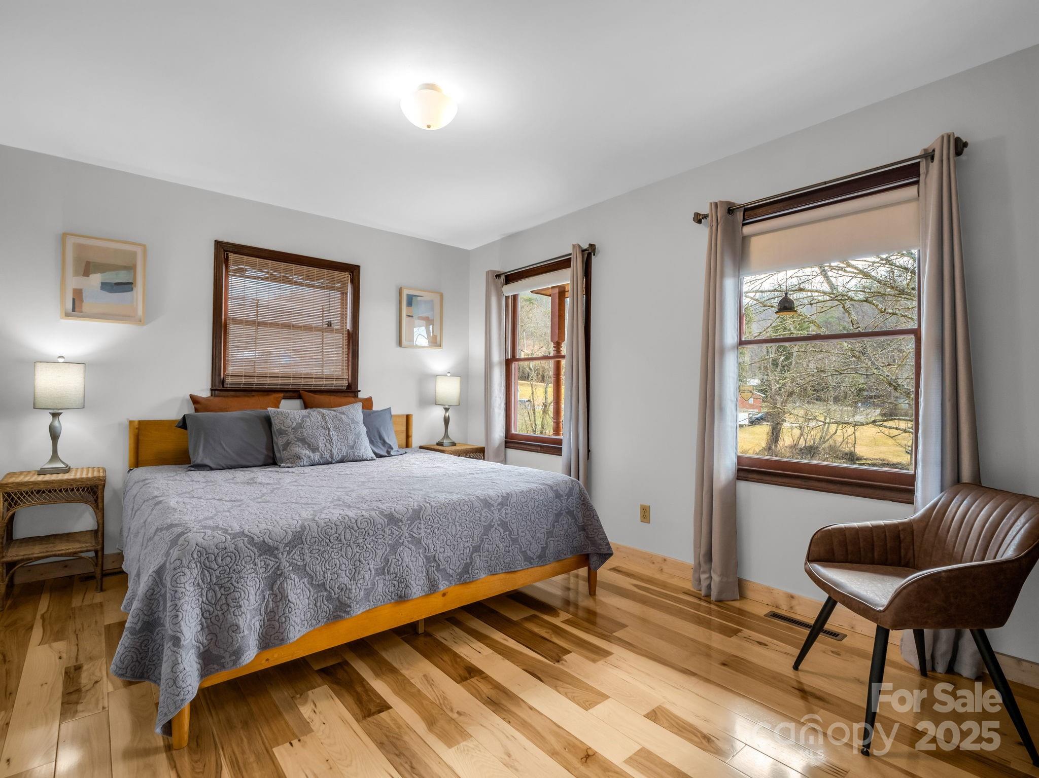 132 Hurd Road Canton, NC 28716 - Photo 30 of 46 a bedroom with a bed and a chair