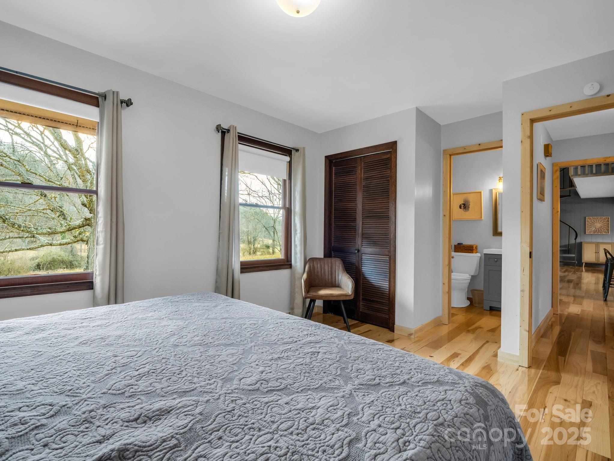 132 Hurd Road Canton, NC 28716 - Photo 31 of 46 a bedroom with a bed and a large window