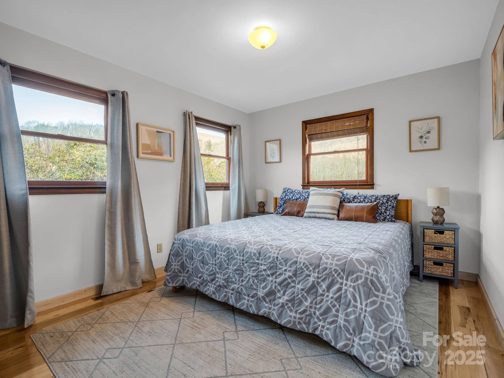 132 Hurd Road Canton, NC 28716 - Photo 33 of 46 a bedroom with a bed and a window