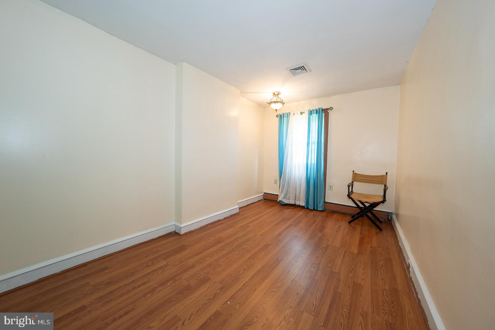 136 Summit Avenue Upper Darby, PA 19082 - Photo 19 of 48 a view of a room with wooden floor and bench