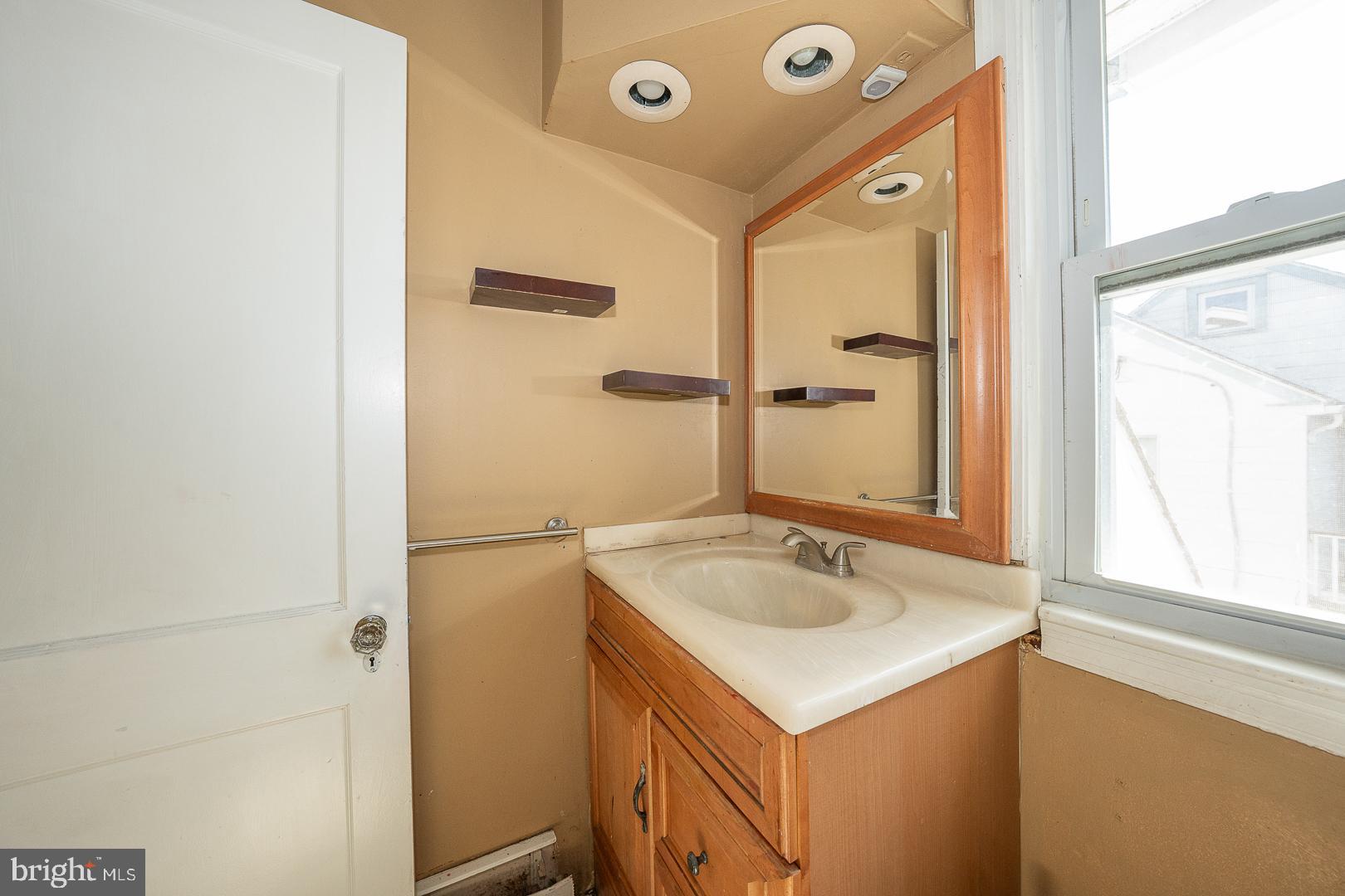 136 Summit Avenue Upper Darby, PA 19082 - Photo 26 of 48 a bathroom with a sink and a mirror
