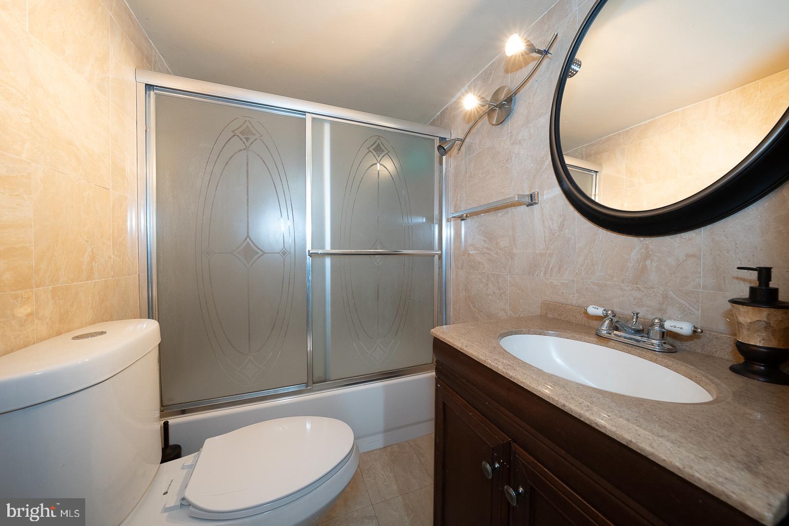 136 Summit Avenue Upper Darby, PA 19082 - Photo 34 of 48 a bathroom with a sink a toilet and a mirror