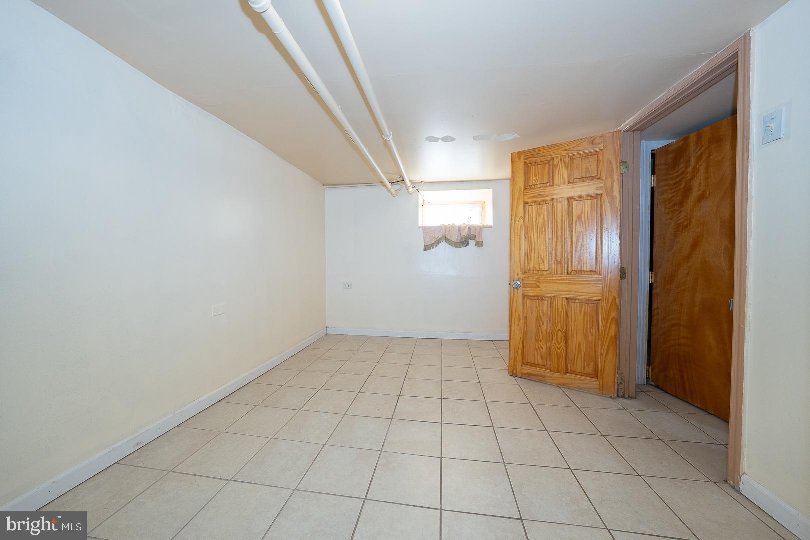 136 Summit Avenue Upper Darby, PA 19082 - Photo 37 of 48 a view of an empty room with window