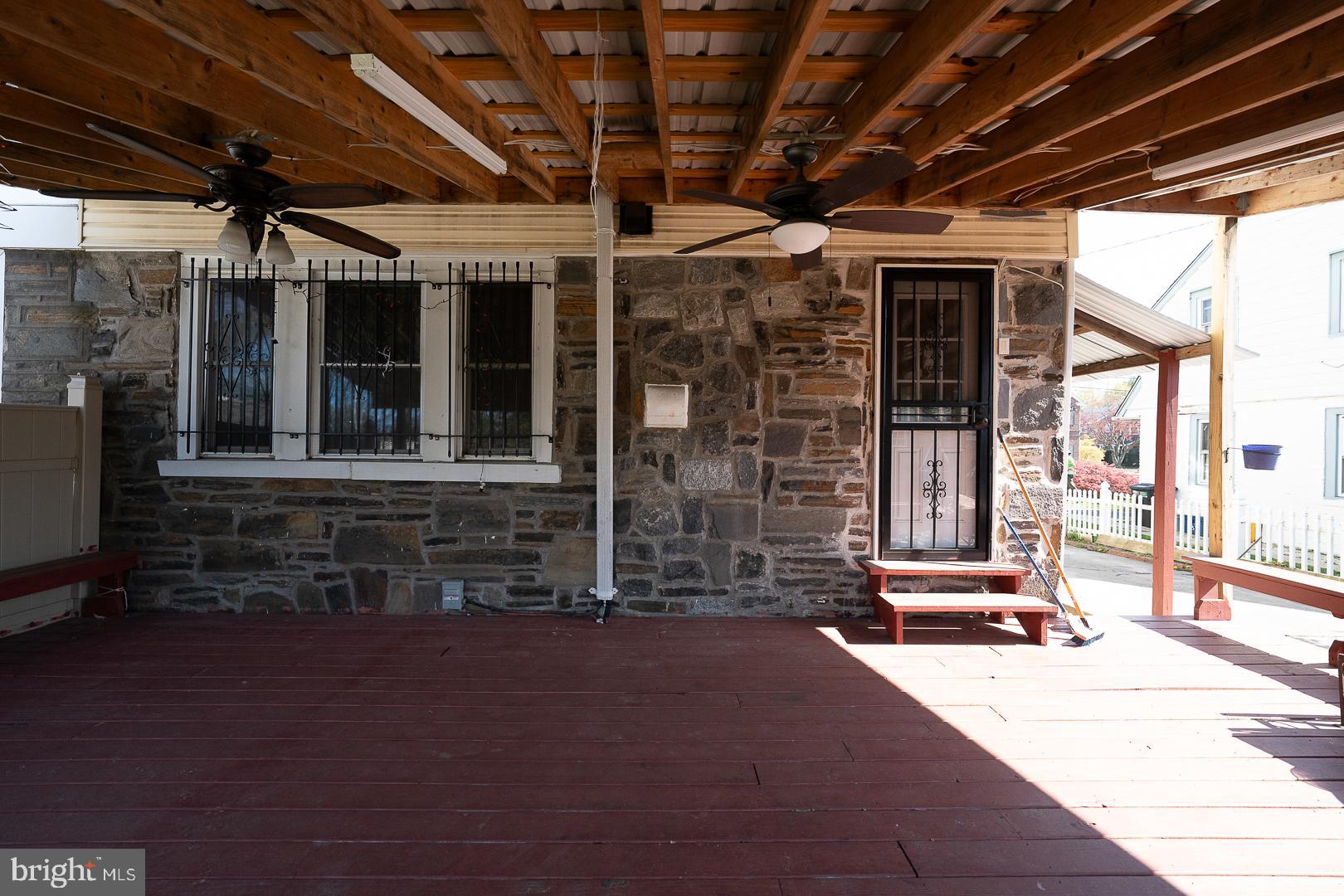 136 Summit Avenue Upper Darby, PA 19082 - Photo 41 of 48 a view of a room with wooden floor and iron stairs