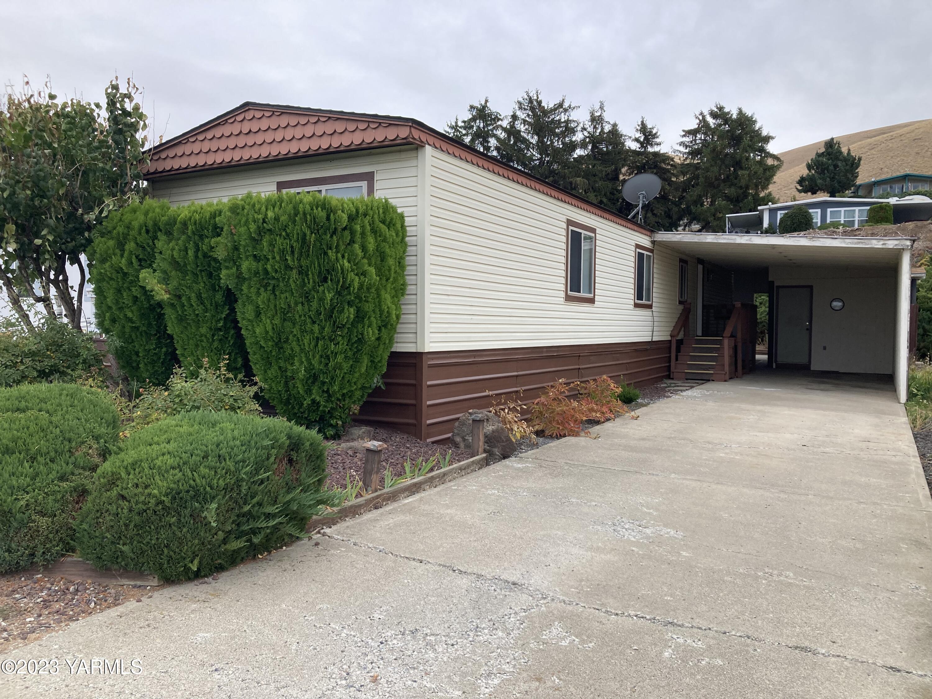 300 Alps Road, Unit 1042 Moxee, WA 98936 - Photo 3 of 15 a view of a house with a backyard