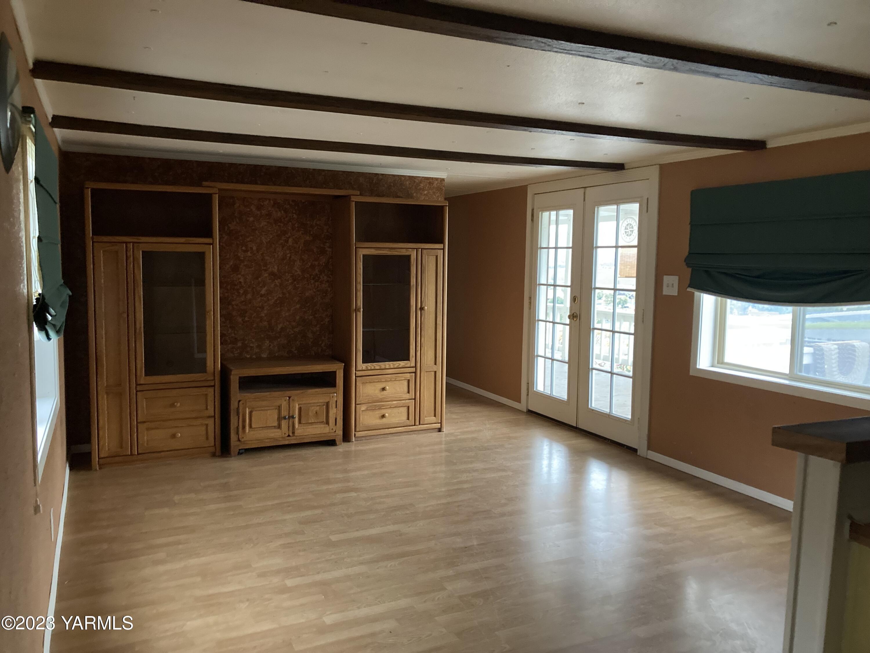 300 Alps Road, Unit 1042 Moxee, WA 98936 - Photo 4 of 15 a view of a room with wooden floor and windows