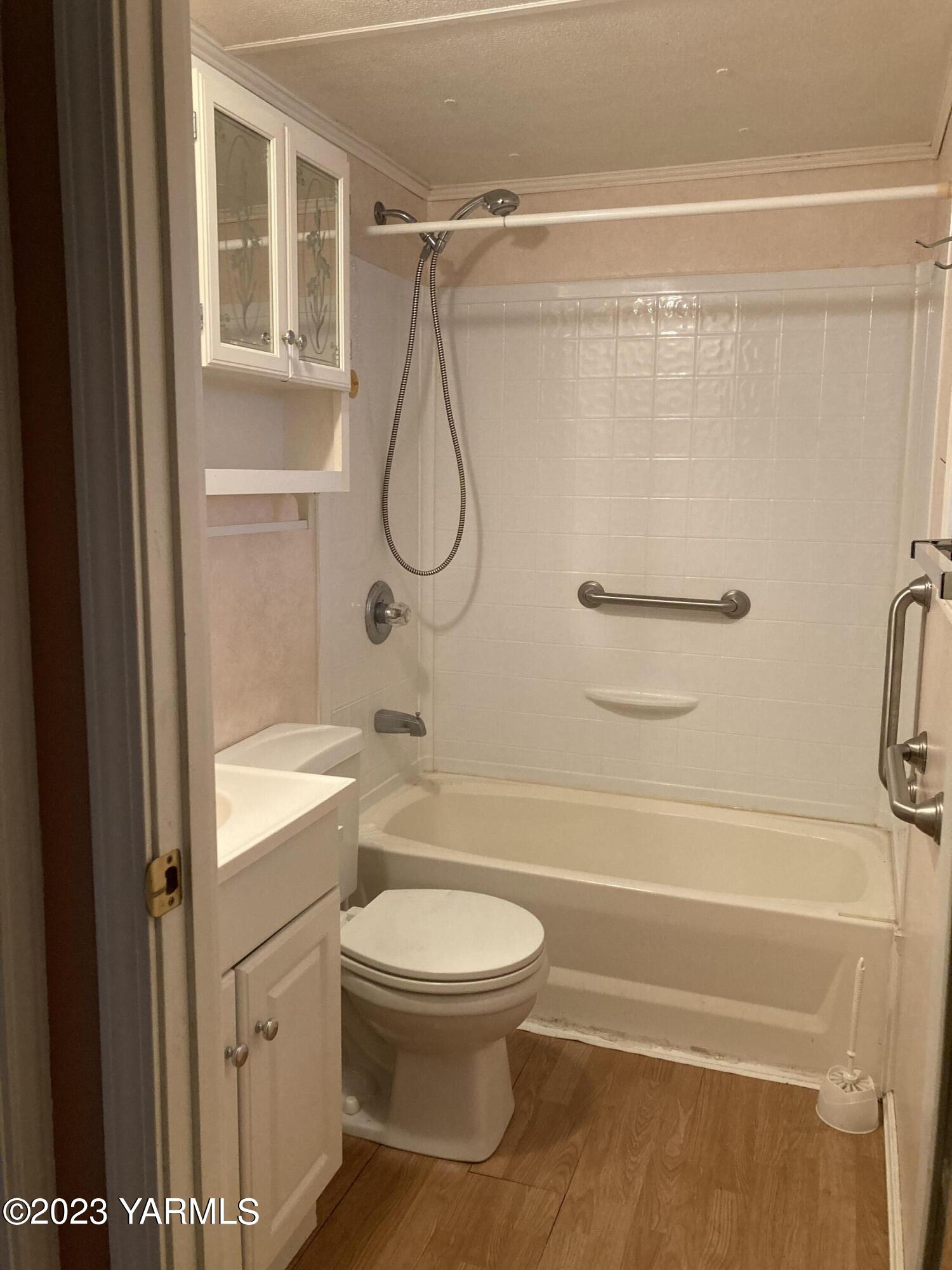 300 Alps Road, Unit 1042 Moxee, WA 98936 - Photo 8 of 15 a bathroom with a toilet and a shower