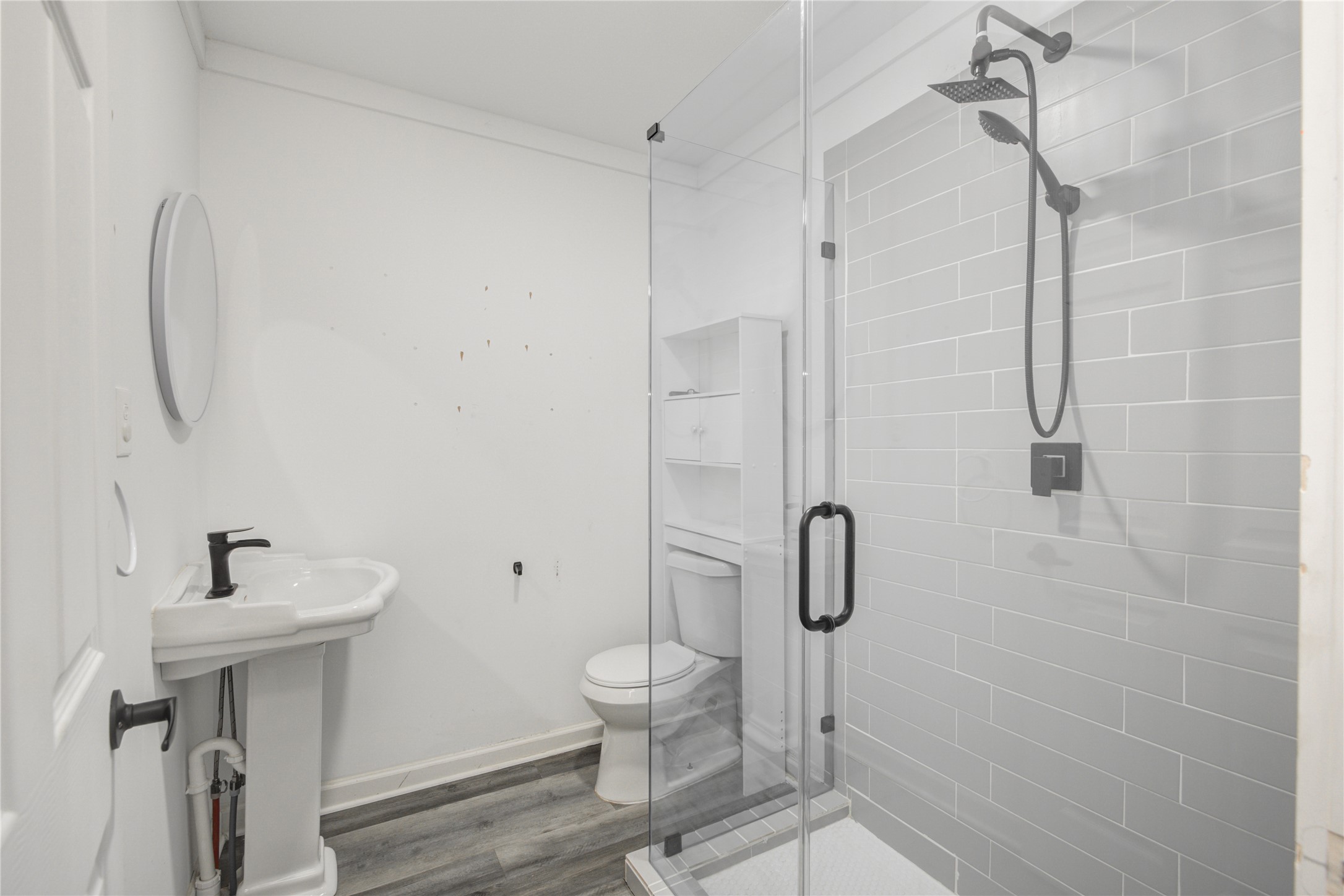 609 Hurst Place Angleton, TX 77515 - Photo 28 of 36 a bathroom with a shower toilet and sink