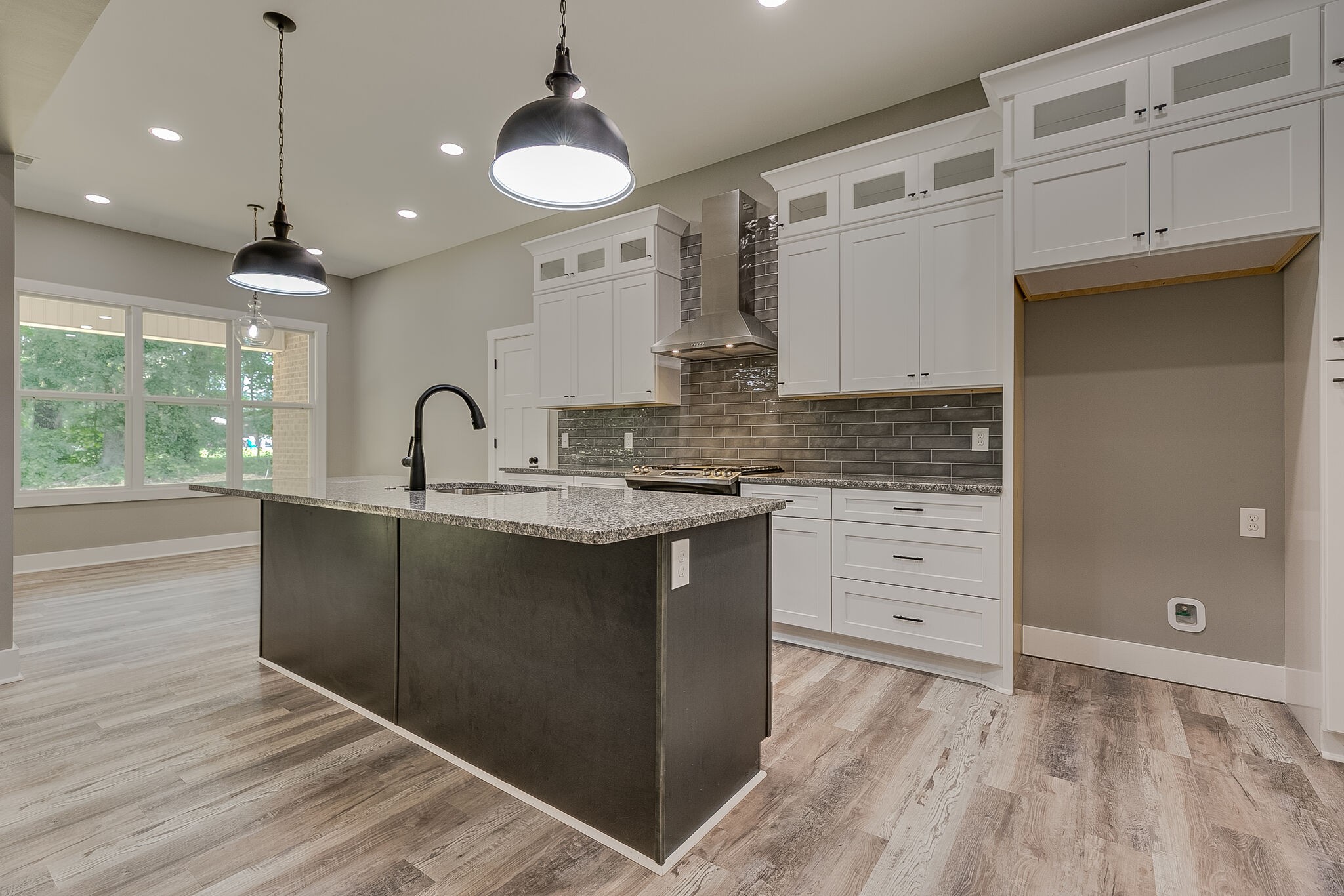 85 Post Road Manchester, TN 37355 - Photo 13 of 48 a kitchen with granite countertop a sink and cabinets