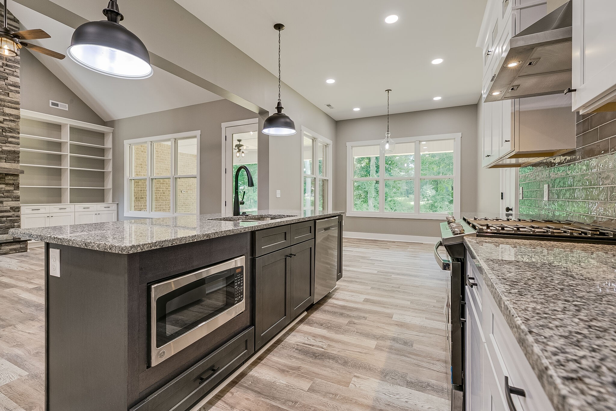 85 Post Road Manchester, TN 37355 - Photo 15 of 48 a kitchen with kitchen island granite countertop a stove and a sink
