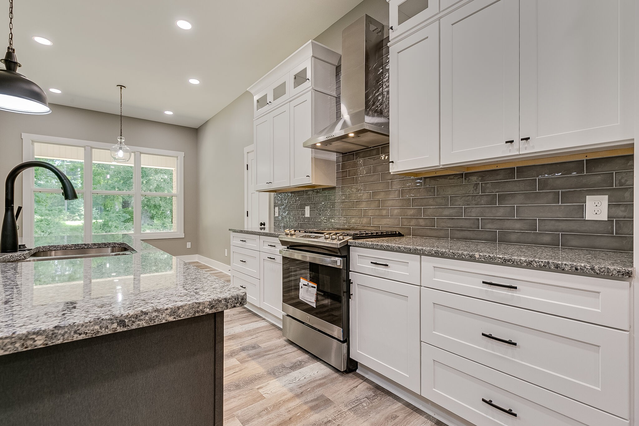 85 Post Road Manchester, TN 37355 - Photo 16 of 48 a kitchen with granite countertop white cabinets and appliances