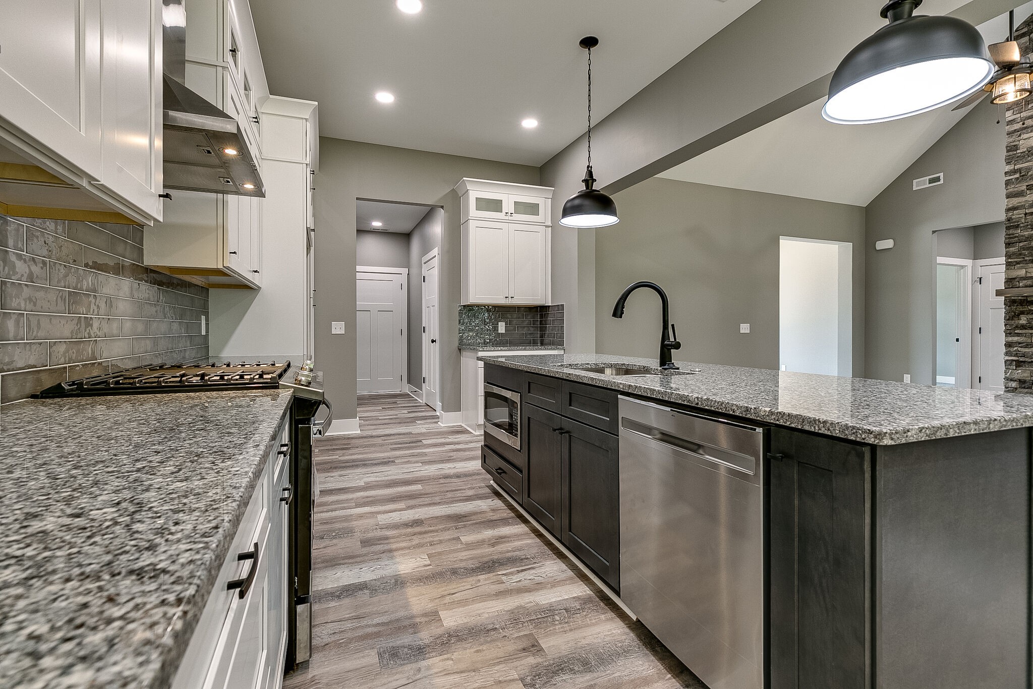 85 Post Road Manchester, TN 37355 - Photo 19 of 48 a large kitchen with stainless steel appliances granite countertop a sink and a refrigerator