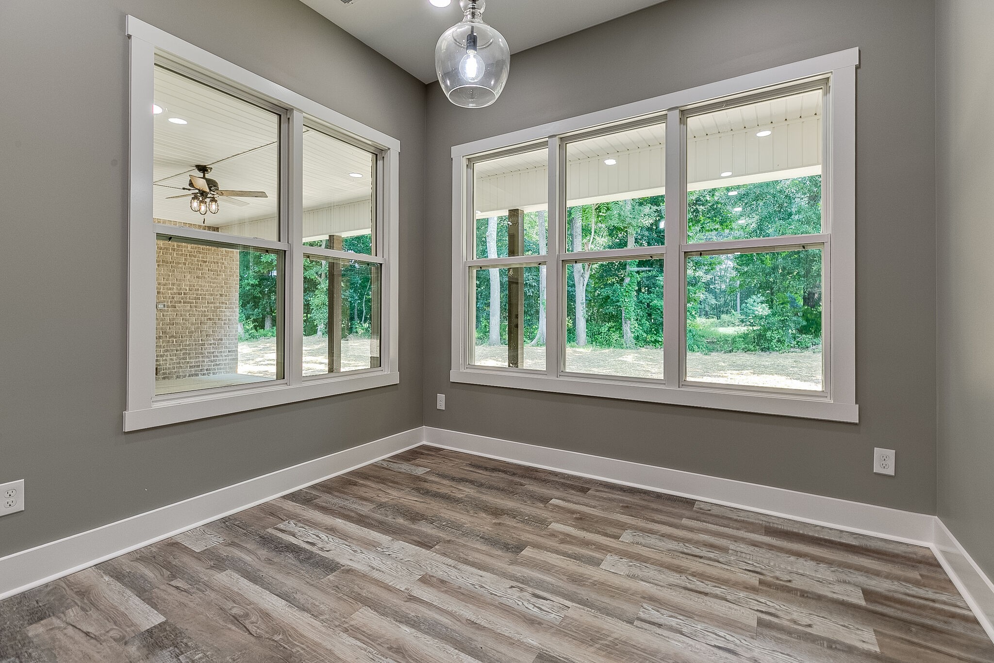 85 Post Road Manchester, TN 37355 - Photo 20 of 48 a view of an empty room with wooden floor and a window