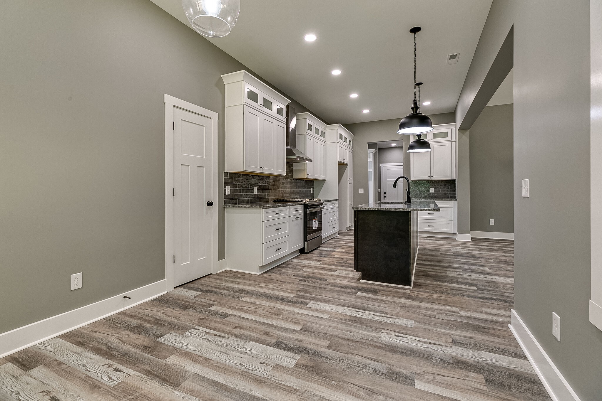 85 Post Road Manchester, TN 37355 - Photo 21 of 48 a kitchen with stainless steel appliances kitchen island granite countertop a refrigerator a stove top oven and cabinets