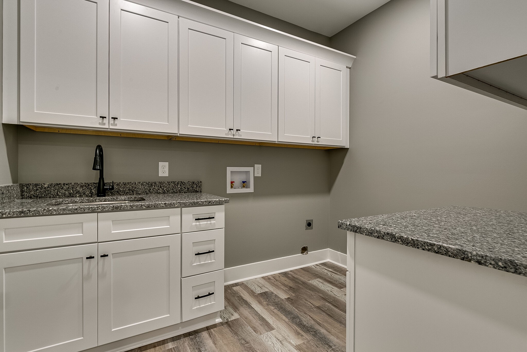 85 Post Road Manchester, TN 37355 - Photo 31 of 48 a kitchen with granite countertop white cabinets and a sink
