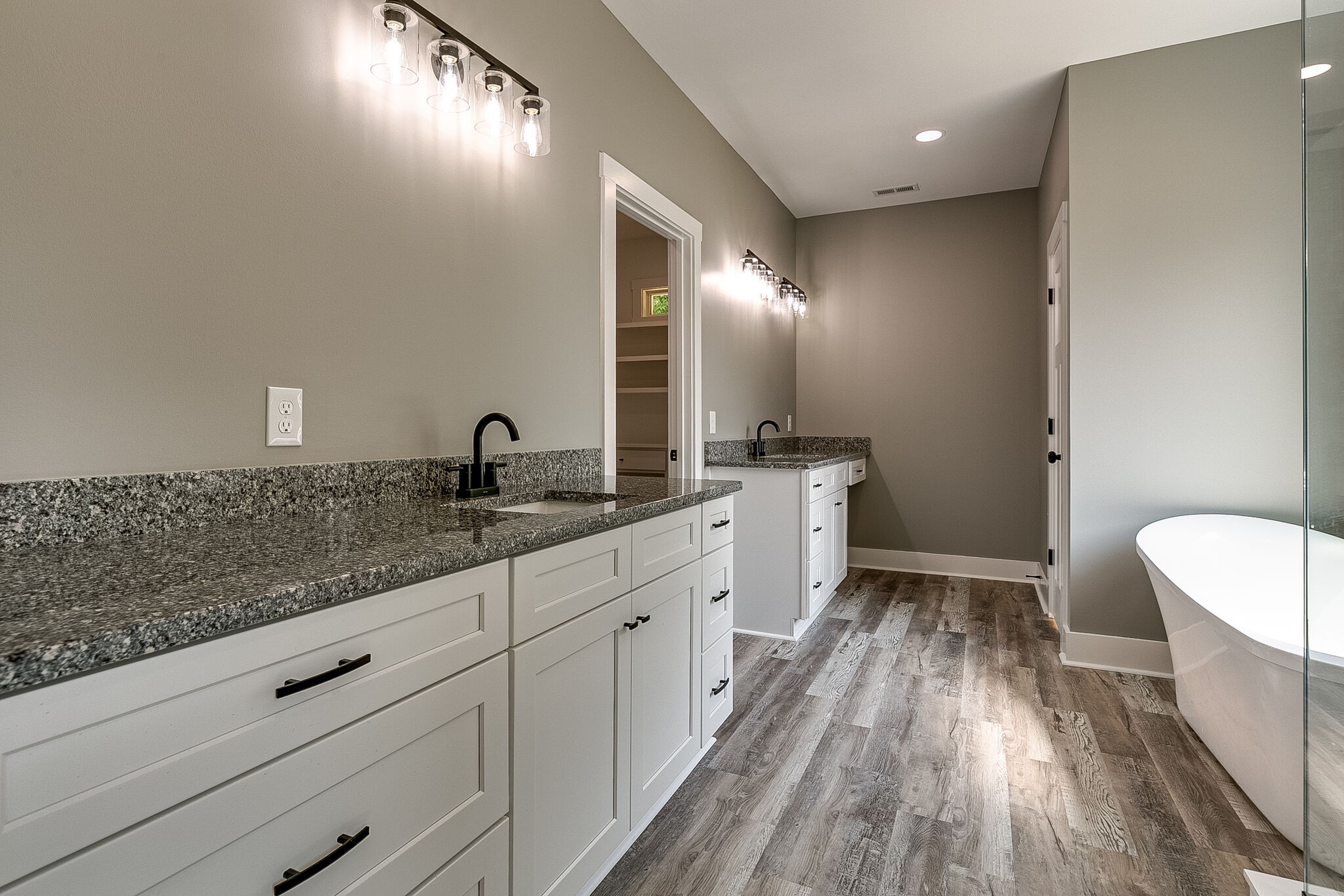 85 Post Road Manchester, TN 37355 - Photo 37 of 48 a spacious bathroom with a granite countertop sink mirror and toilet