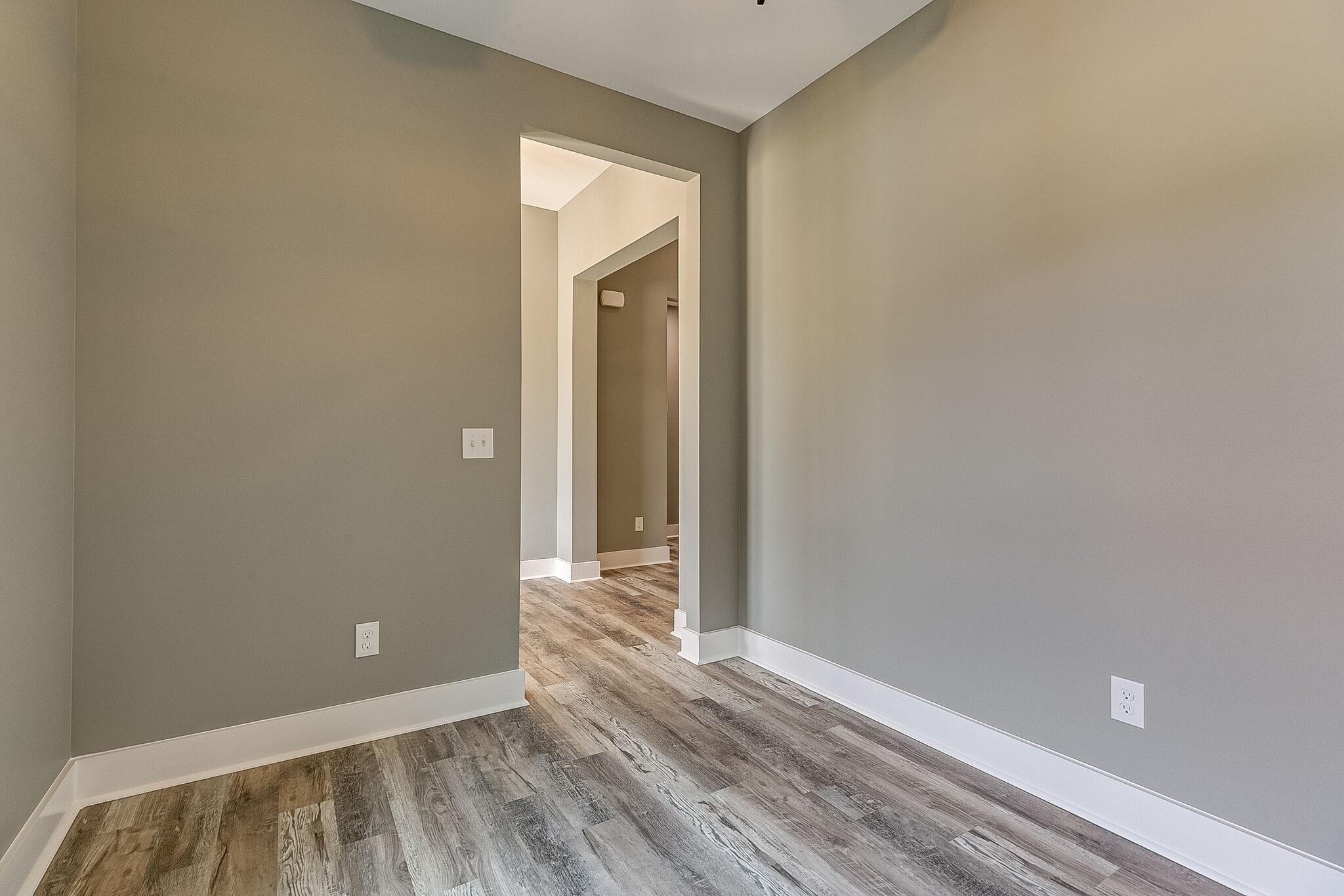 85 Post Road Manchester, TN 37355 - Photo 8 of 48 a view of an empty room with wooden floor and a window
