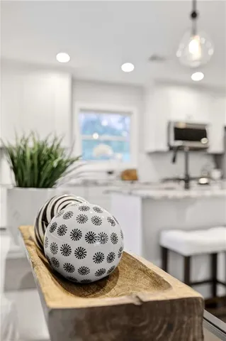 a kitchen with stainless steel appliances granite countertop a sink a stove a microwave a refrigerator and cabinets