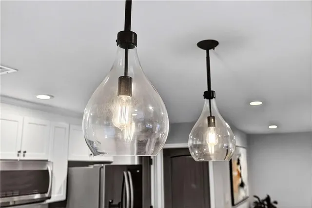 a kitchen with a sink stove and refrigerator