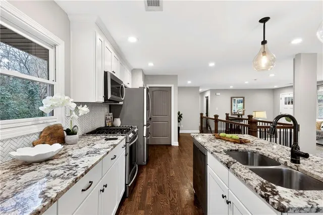 a kitchen with a stove and a microwave