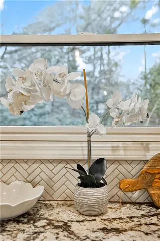 a bedroom with furniture and wooden floor