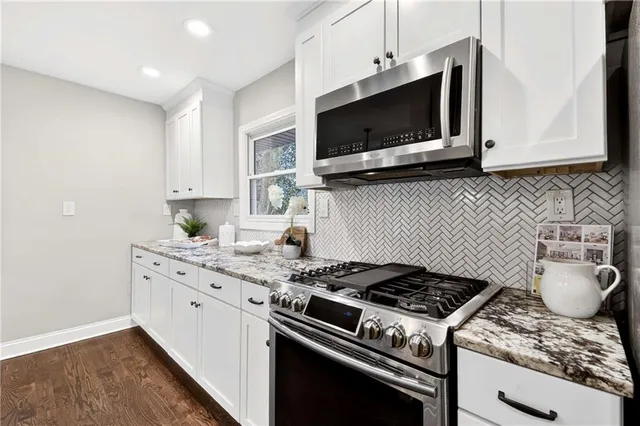 a bed sitting in a bedroom next to a bed