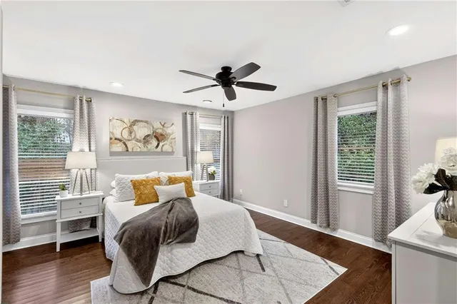 a bathroom with a granite countertop sink mirror and vanity