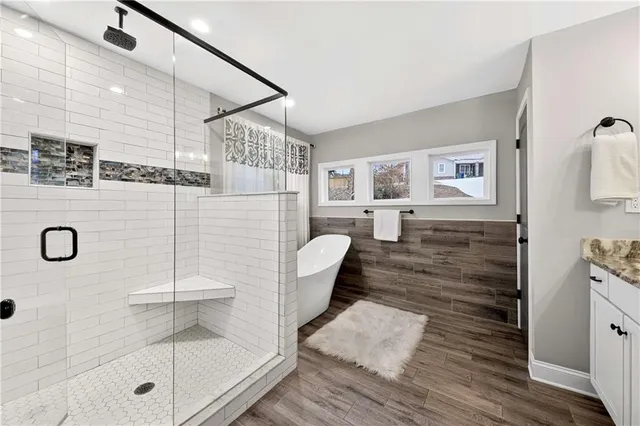 a bathroom with a sink toilet and shower