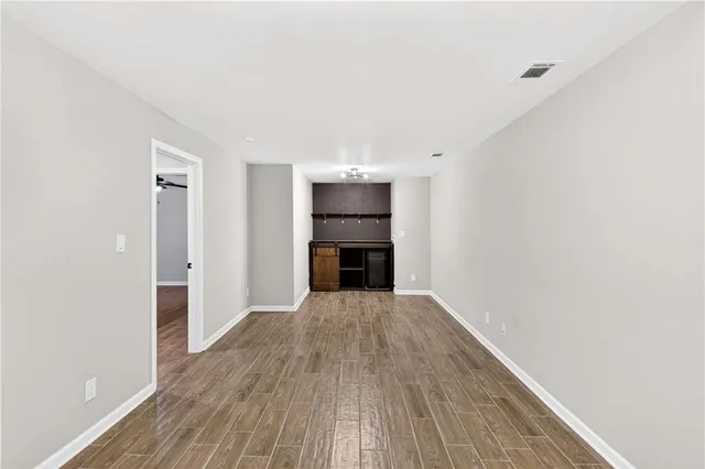 a view of a backyard with large trees