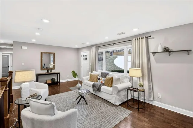 a living room with furniture and a rug