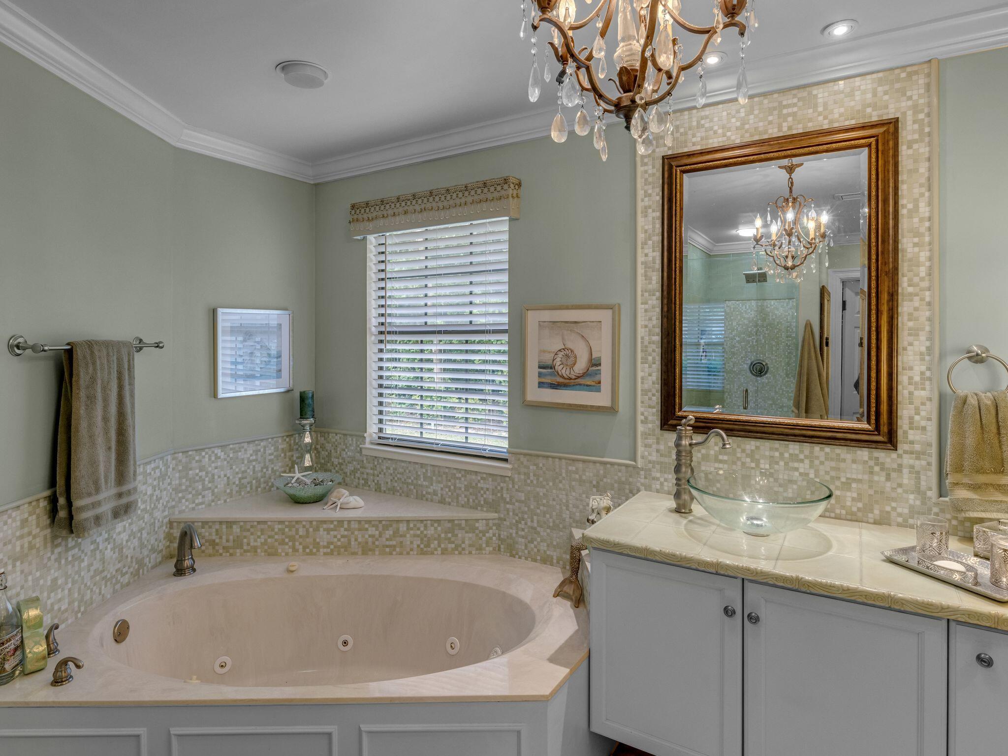 370 Golfview Drive Miramar Beach, FL 32550 - Photo 105 of 148 a bathroom with a tub a sink and mirror