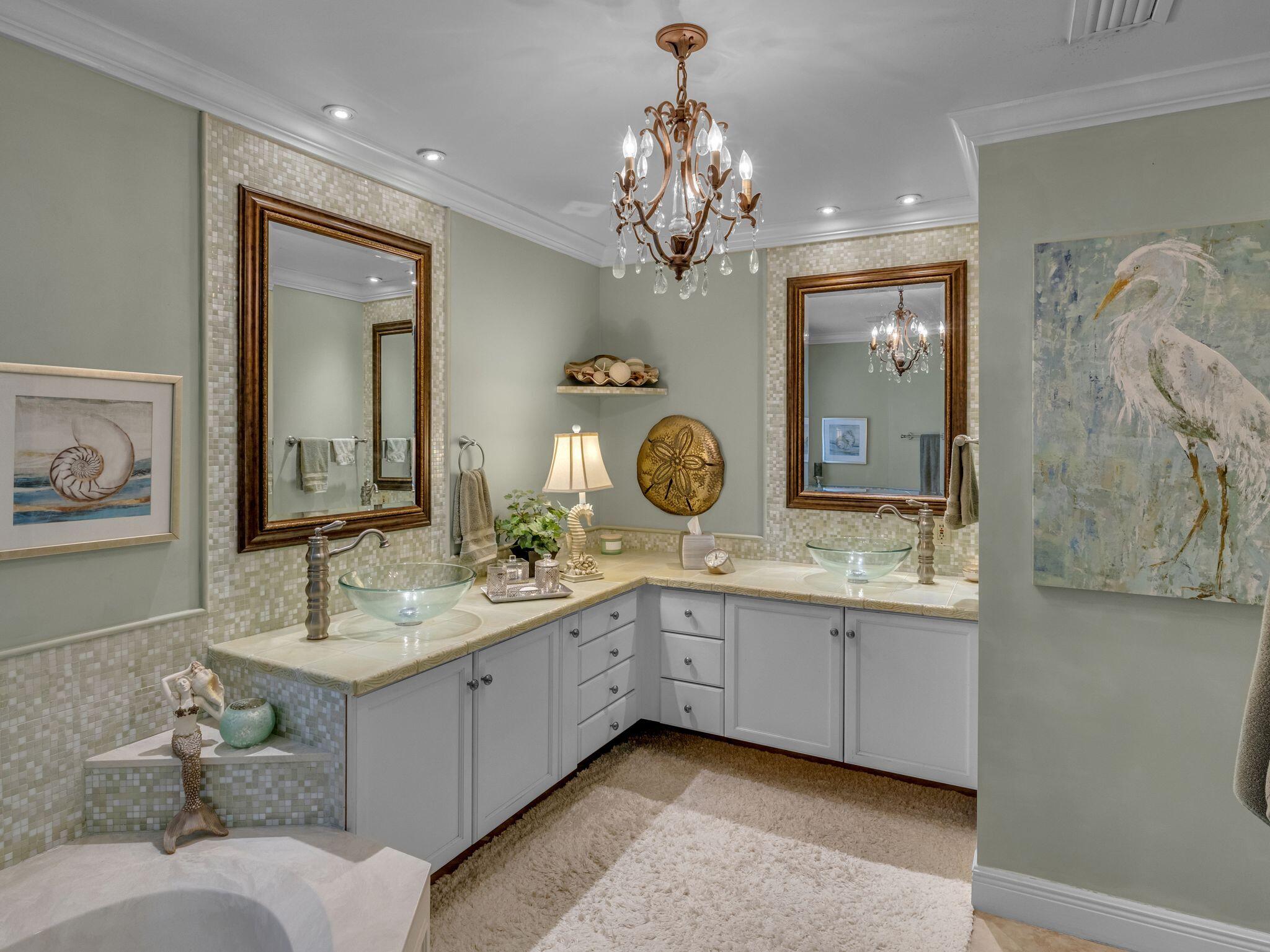 370 Golfview Drive Miramar Beach, FL 32550 - Photo 106 of 148 a bathroom with a granite countertop sink a large mirror and a shower