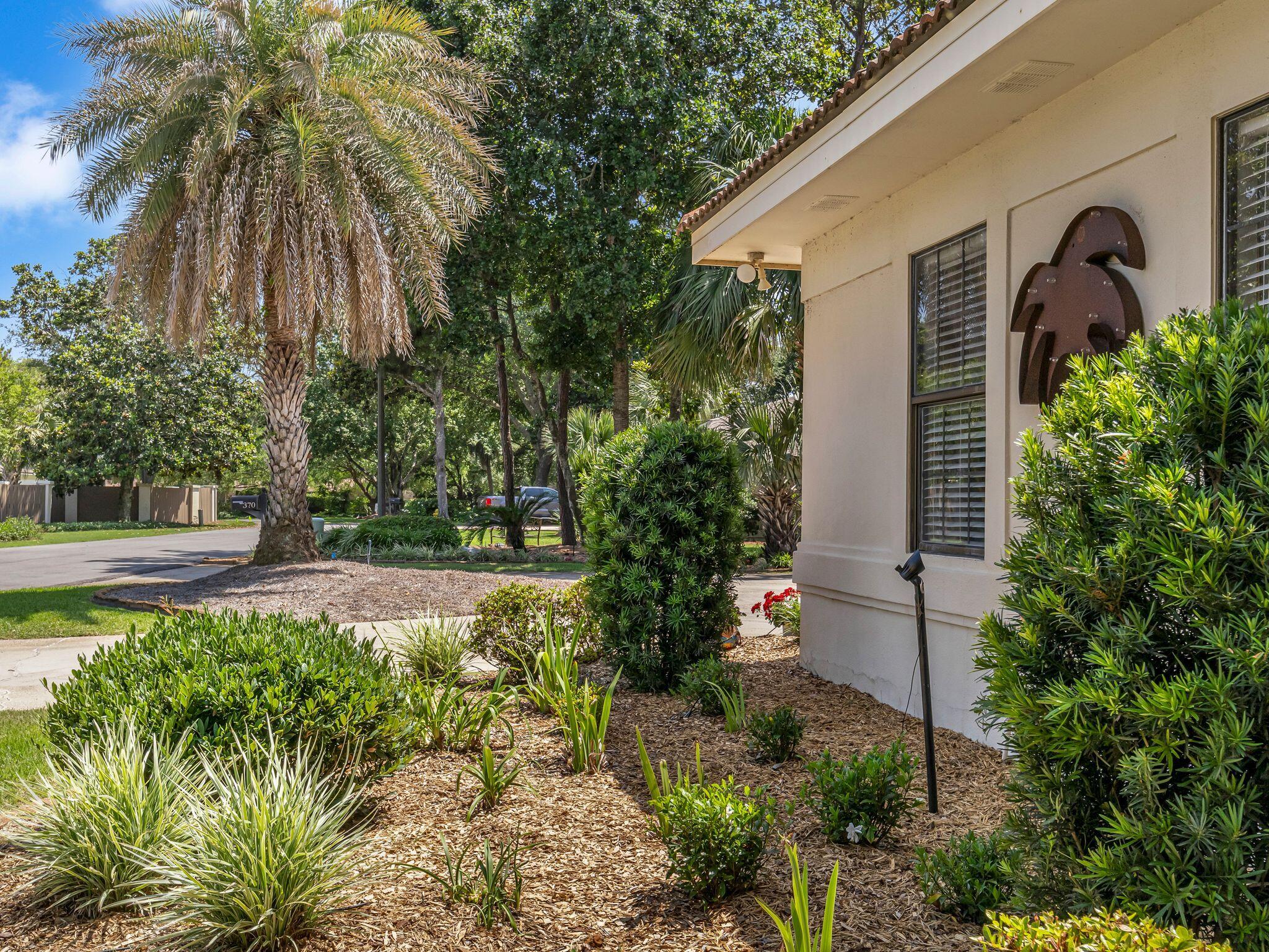 370 Golfview Drive Miramar Beach, FL 32550 - Photo 132 of 148 a front view of a house with garden