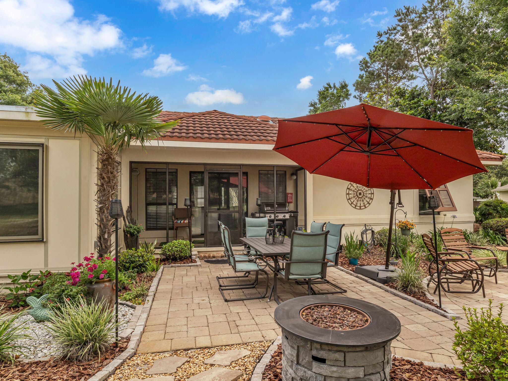 370 Golfview Drive Miramar Beach, FL 32550 - Photo 136 of 148 a view of a backyard with sitting area and furniture