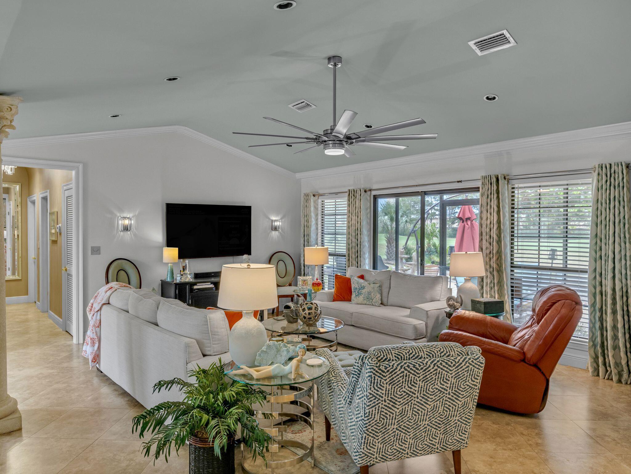 370 Golfview Drive Miramar Beach, FL 32550 - Photo 17 of 148 a living room with furniture a flat screen tv and a large window