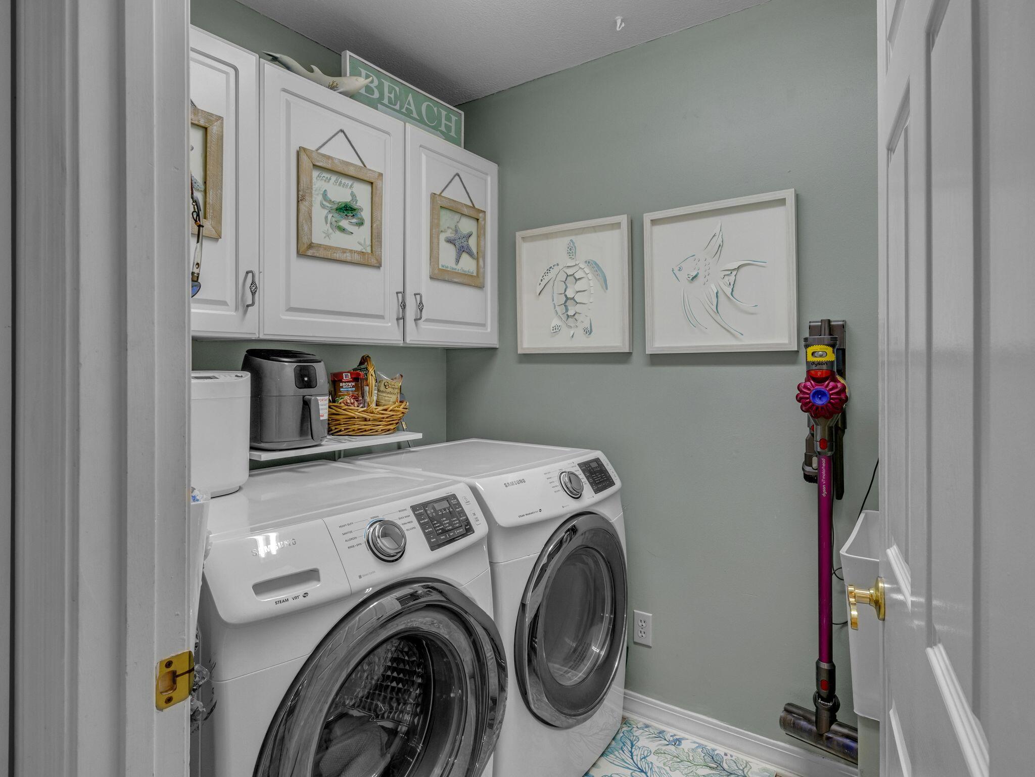 370 Golfview Drive Miramar Beach, FL 32550 - Photo 26 of 148 a utility room with dryer and washer