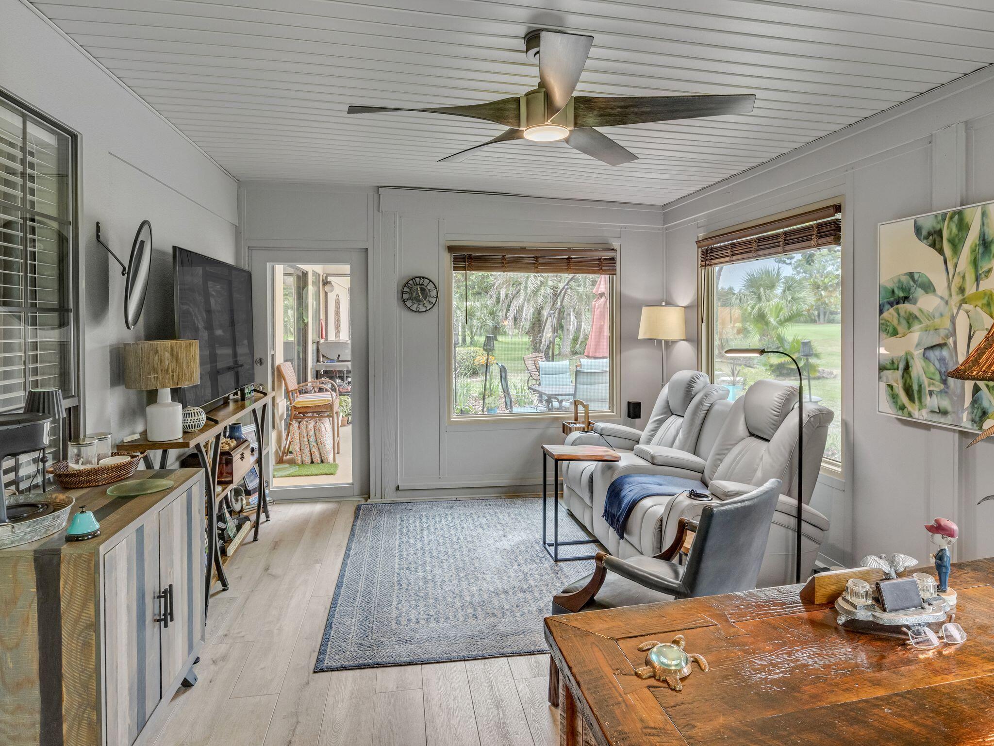 370 Golfview Drive Miramar Beach, FL 32550 - Photo 33 of 148 a living room with furniture a window and a flat screen tv