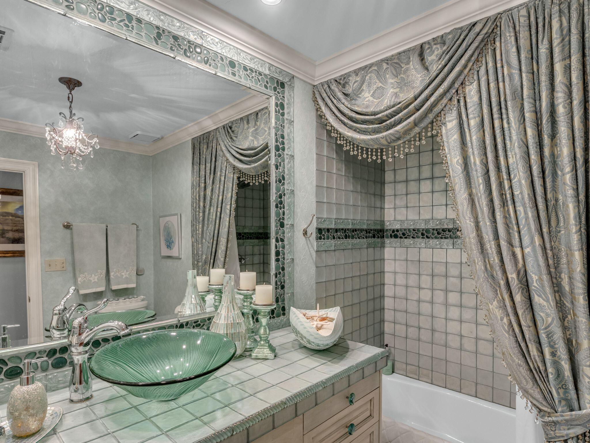 370 Golfview Drive Miramar Beach, FL 32550 - Photo 36 of 148 a bathroom with a sink a mirror and a shower